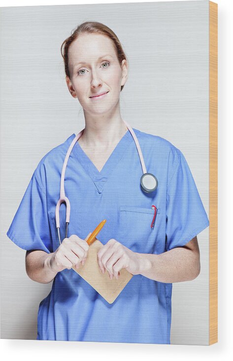 People Wood Print featuring the photograph Female Doctor In Scrubs by James Whitaker