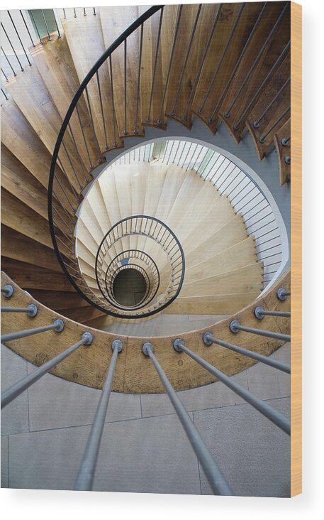 Curve Wood Print featuring the photograph High Angle View Of A Spiral Staircase by Ludger Paffrath