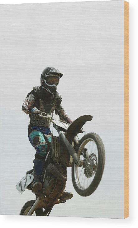 Crash Helmet Wood Print featuring the photograph Low Angle View Of A Motocross Rider by Glowimages