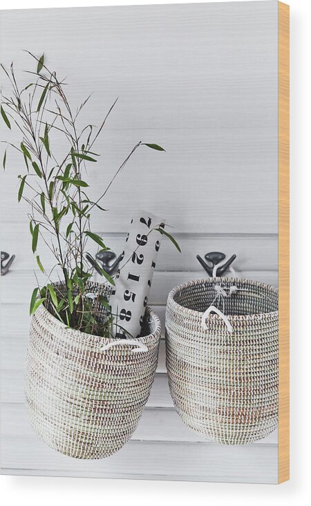 Two Storage Baskets Hung From Coat Hooks Wood Print by Nicoline Olsen -  Pixels