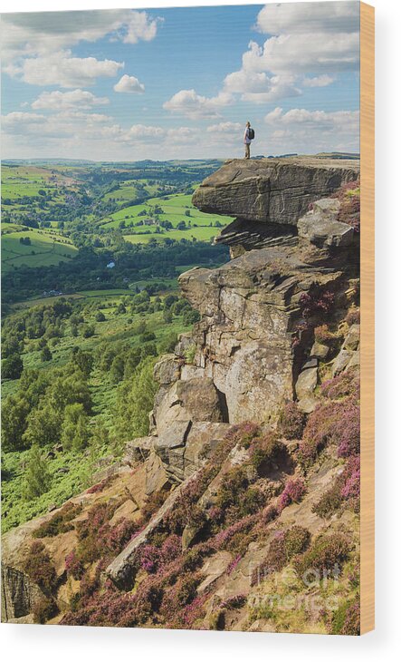 Derbyshire Wood Print featuring the photograph Hiker standing alone on Froggatt Edge, Derbyshire Peak District National Park, England by Neale And Judith Clark