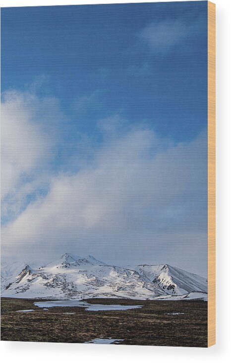 Iceland Wood Print featuring the photograph Icelandic landscape with mountains and meadow land covered in sn by Michalakis Ppalis