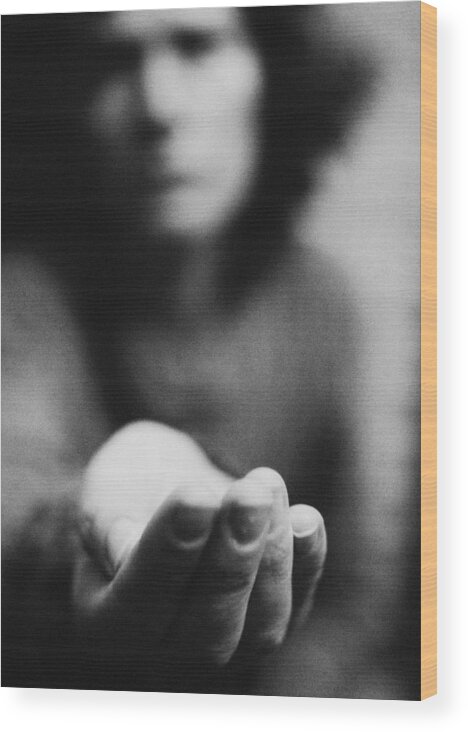 Debt Wood Print featuring the photograph Woman holding hand out, blurred, b&w by Laurent Hamels