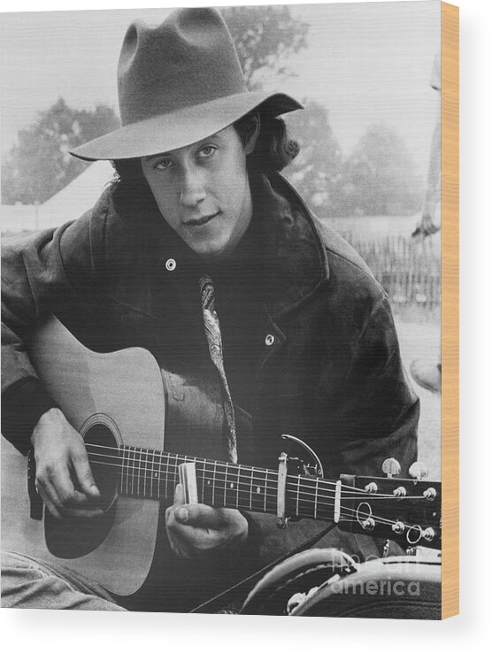 Young Men Wood Print featuring the photograph Arlo Guthrie With His Guitar by Bettmann