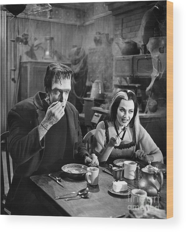 Breakfast Wood Print featuring the photograph Herman And Lily Munster At Breakfast by Bettmann
