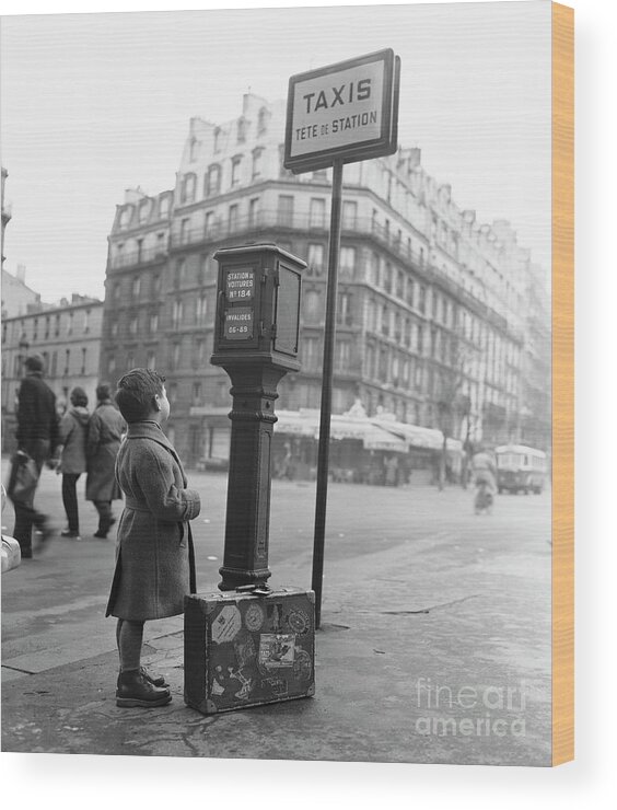 People Wood Print featuring the photograph Young French Boy Waiting For A Taxi by Bettmann