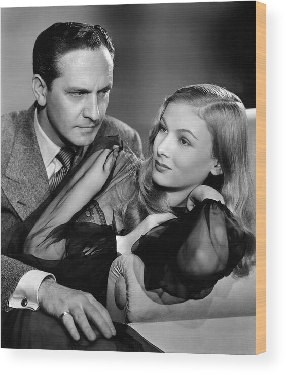 Fredric March Wood Print featuring the photograph FREDRIC MARCH and VERONICA LAKE in I MARRIED A WITCH -1942-, directed by RENE CLAIR. by Album