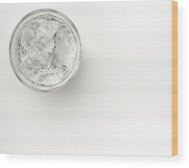 White Background Wood Print featuring the photograph A Glass Of Sparkling Water With Ice by Anthony Bradshaw