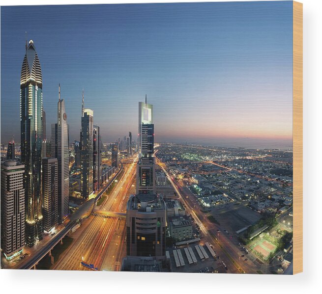 Arabia Wood Print featuring the photograph Dubai Skyline At Dusk, United Arab by Matteo Colombo