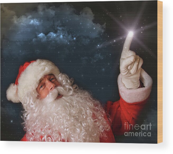 Advertising Space Wood Print featuring the photograph Santa pointing with magical light to the sky by Sandra Cunningham