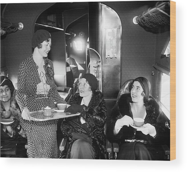 1920s Wood Print featuring the photograph Tea Time In The Airplane by Underwood Archives