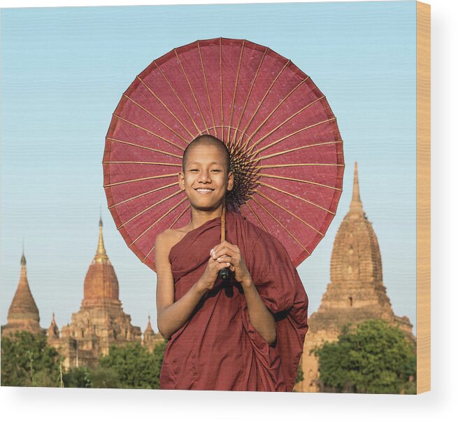 Adolescence Wood Print featuring the photograph Young Buddhist Monk Holding Traditional by Martin Puddy