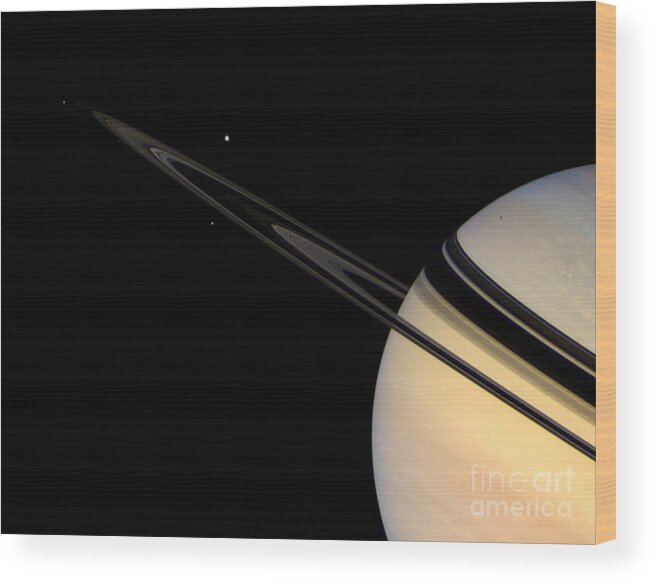 Saturn Wood Print featuring the photograph Saturn And Its Moons by NASA/Science Source