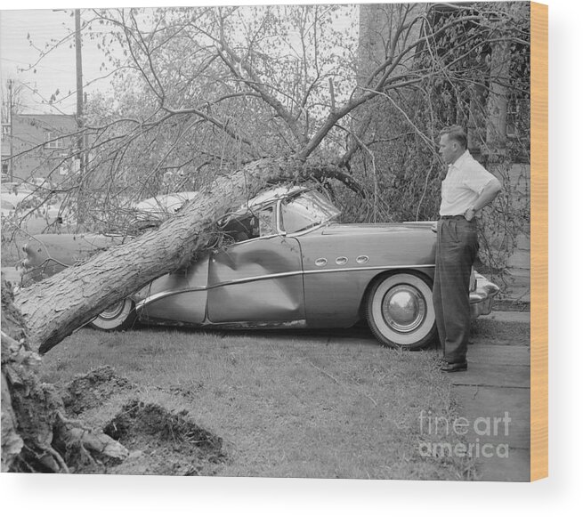 Mature Adult Wood Print featuring the photograph Man Looking At His Damaged Car #1 by Bettmann
