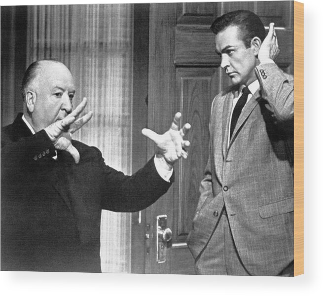 #sean_connery Wood Print featuring the photograph Alfred Hitchcock Talking With Sean Connery by Globe Photos