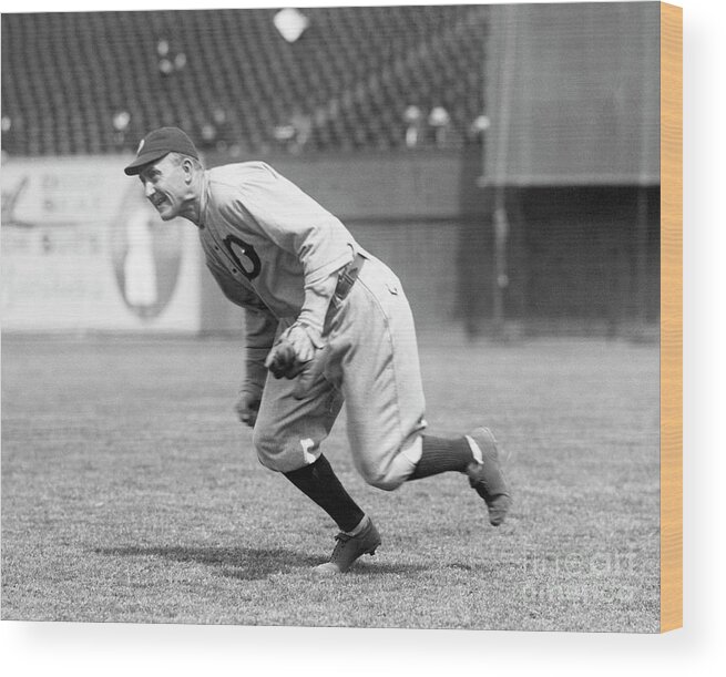People Wood Print featuring the photograph Baseball Player Ty Cobb Fielding Ball by Bettmann