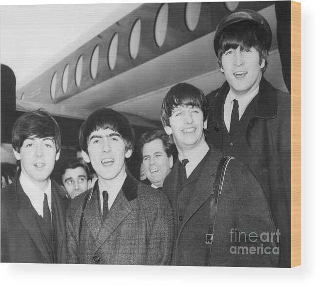 Rock Music Wood Print featuring the photograph Beatles Arriving At Heathrow Airport by Bettmann