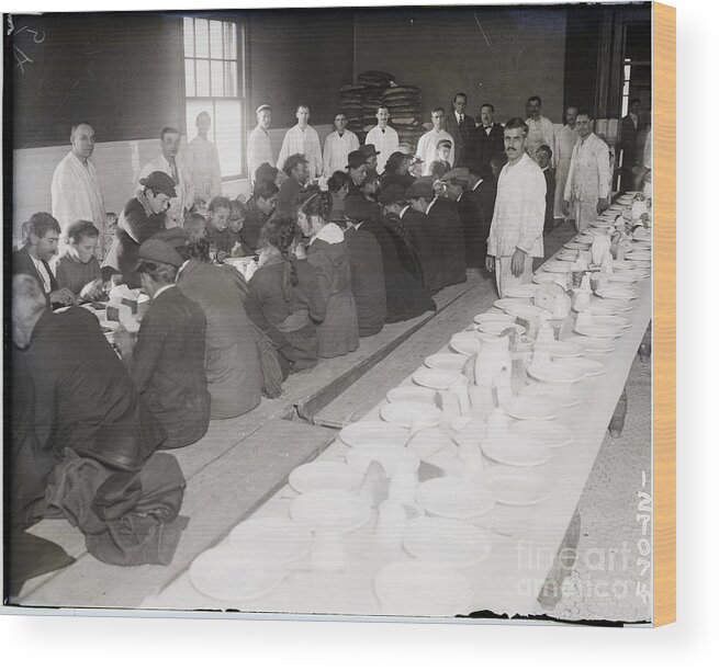 Coin Wood Print featuring the photograph Immigrants Being Served Dinner by Bettmann