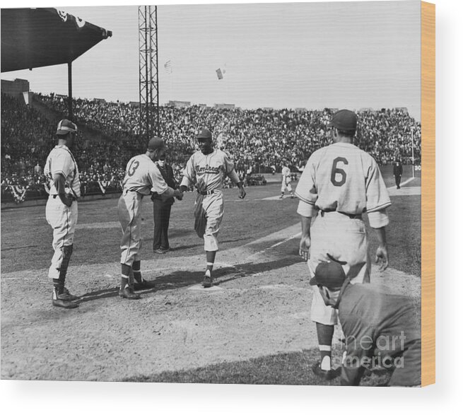 Crowd Of People Wood Print featuring the photograph Jackie Robinson After Hitting A Homer by Bettmann