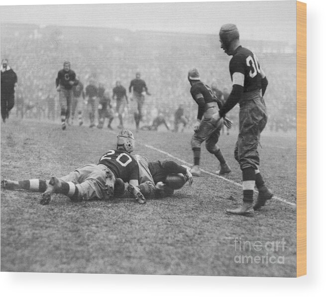 People Wood Print featuring the photograph Jim Thorpe Tackling Player by Bettmann