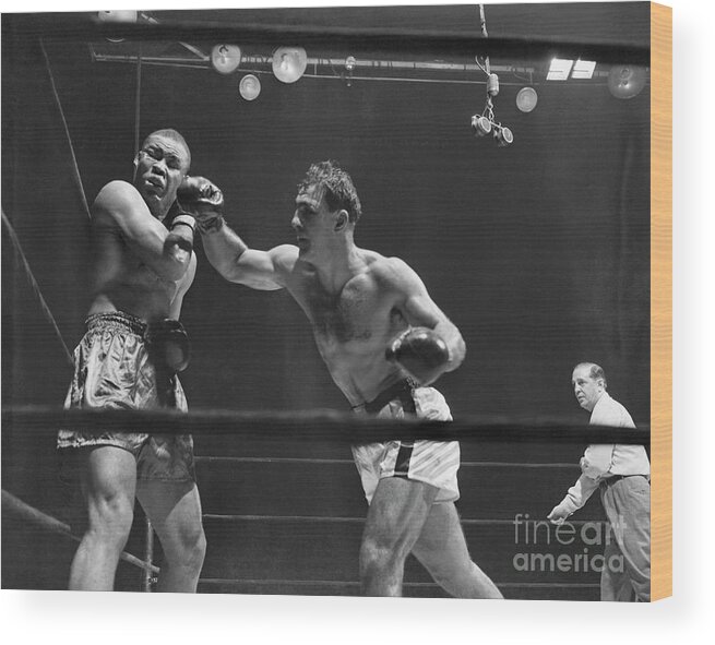 People Wood Print featuring the photograph Joe Louis And Rocky Marciano Boxing by Bettmann