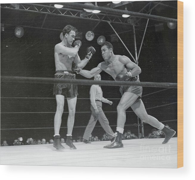 People Wood Print featuring the photograph Joe Louis Punching Billy Conn by Bettmann