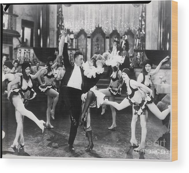 Child Wood Print featuring the photograph John Gilbert Dances With Girls In Movie by Bettmann