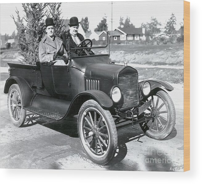Oliver Hardy Wood Print featuring the photograph Laurel And Hardy In A Model T Ford by Bettmann