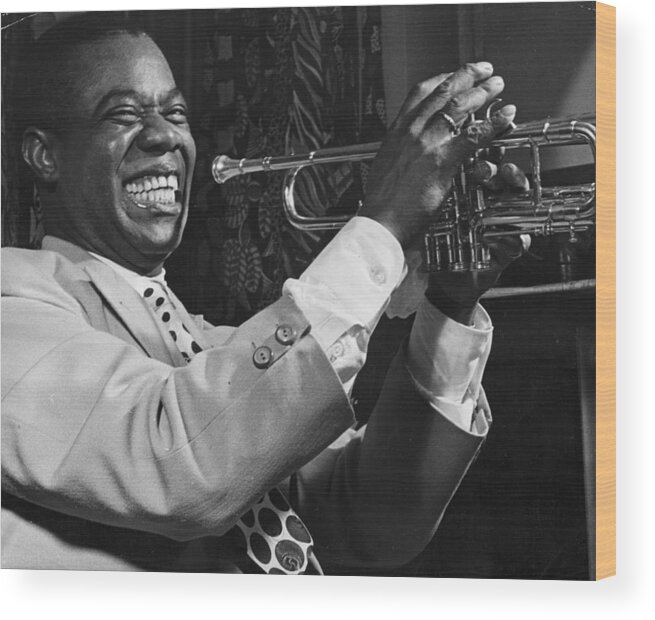 Concert Wood Print featuring the photograph Louis Armstrong Holding Trumpet by Bettmann