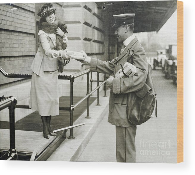 Mid Adult Women Wood Print featuring the photograph Mailman Delivering Packages To Woman by Bettmann