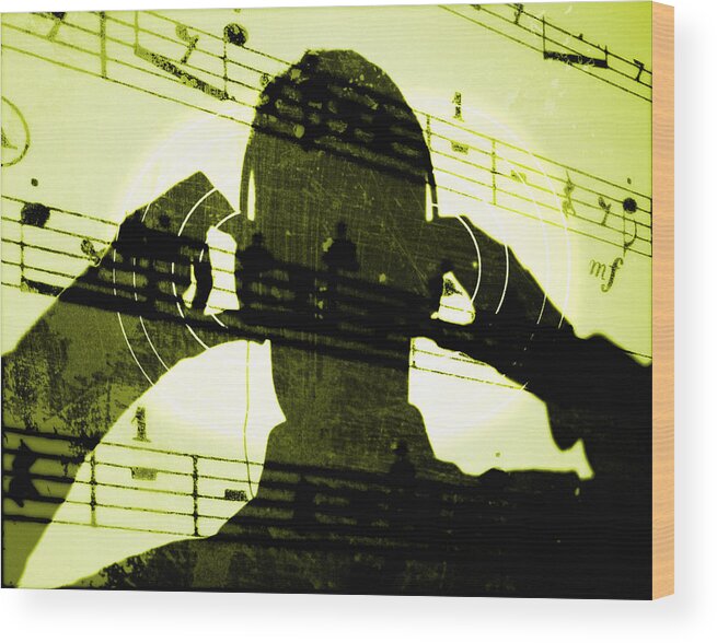 Sheet Music Wood Print featuring the photograph Man Listening To Music On Headphones by Jason Reed/ryan Mcvay