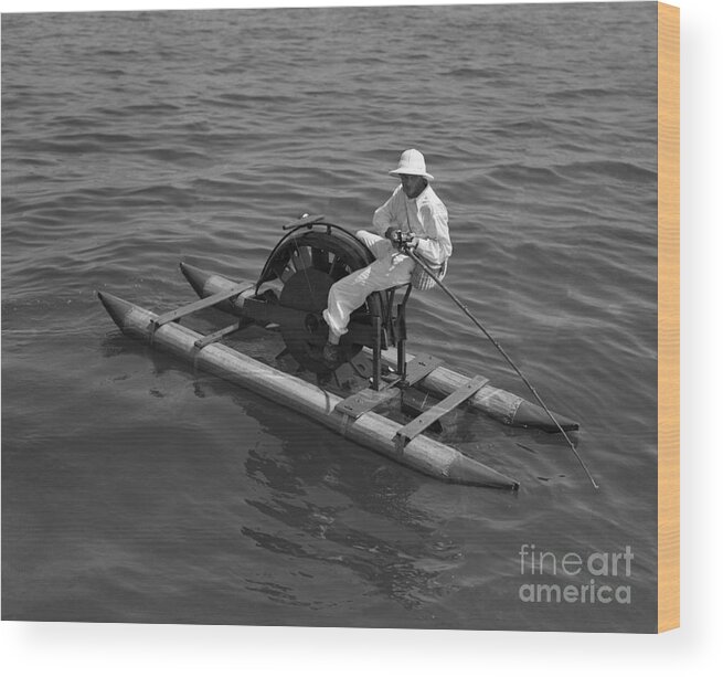 Young Men Wood Print featuring the photograph Man On Paddleboat Fishing by Bettmann