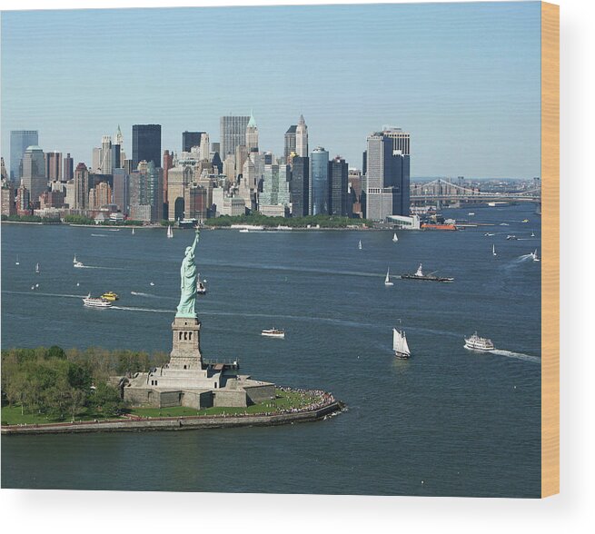 Lower Manhattan Wood Print featuring the photograph New York Harbor And Skyline by Terraxplorer