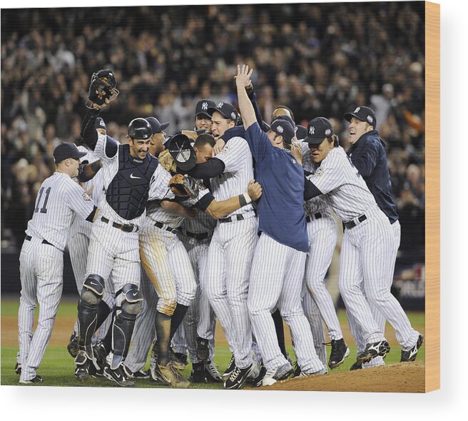 American League Baseball Wood Print featuring the photograph New York Yankees Celebrate After by New York Daily News Archive