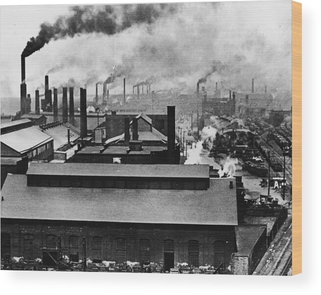 Outdoors Wood Print featuring the photograph Rooftops And Smokestacks Of Factories by Welgos