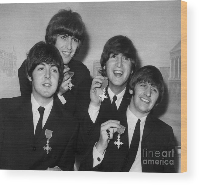 Rock Music Wood Print featuring the photograph The Beatles Holding Medals by Bettmann