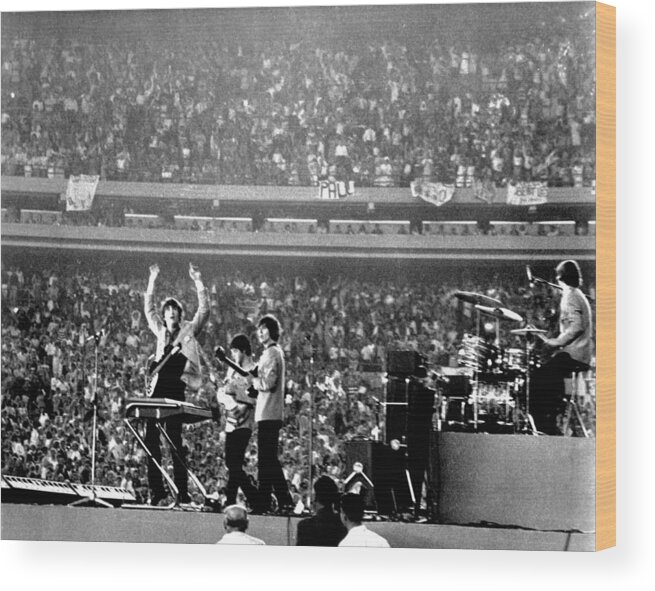 Paul Mccartney Wood Print featuring the photograph The Beatles by Michael Ochs Archives