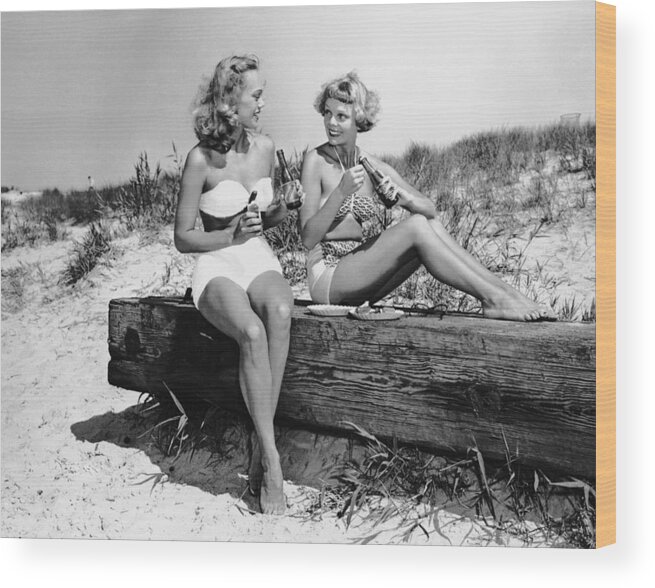 People Wood Print featuring the photograph Two Women Drinking Soda On Beach by George Marks