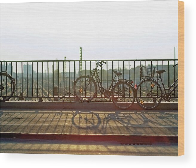 Shadow Wood Print featuring the photograph Bicycles Leaning On Fence by Janusz Ziob