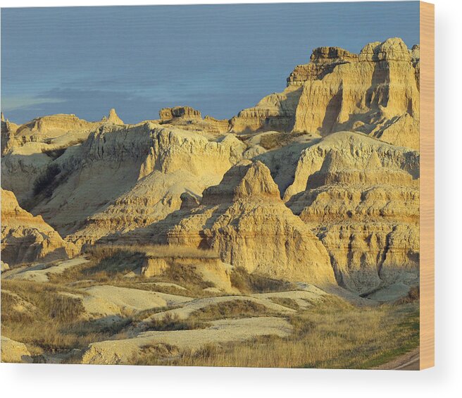 Badlands National Park South Dakota Sd Parks North America American Badland Landscape Landscapes Sandstone Sandy Formations Formation Bad Lands Sky Skies Dusk Neutral Beige Colors Rugged Beauty Scenic Scenery Hiking Travel Vacation Destinations Blue Rapid City Brown Lighting Light Dimensional Dimensions Photography Photos Artistic Art Unique Rocky Rock Rocks James Melissa Peterson Nature Outdoor Wilderness Adventure Wall Buttes Pinnacles Grass Prairie Southwestern Dynamic Golden Hour Unusual Wood Print featuring the photograph Dynamic Lighting by James Peterson