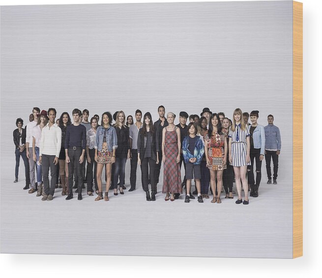 Young Men Wood Print featuring the photograph Large Group of people standing together in studio by Nisian Hughes