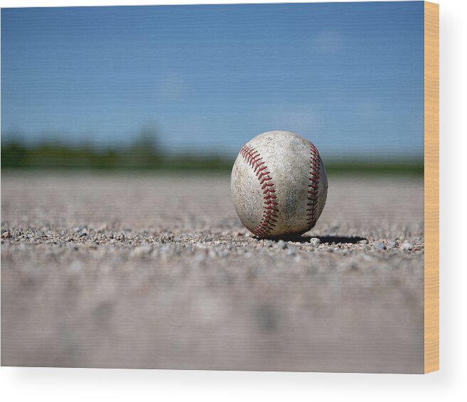 Outdoors Wood Print featuring the photograph Old Baseball Sits On The Field by Cara Slifka