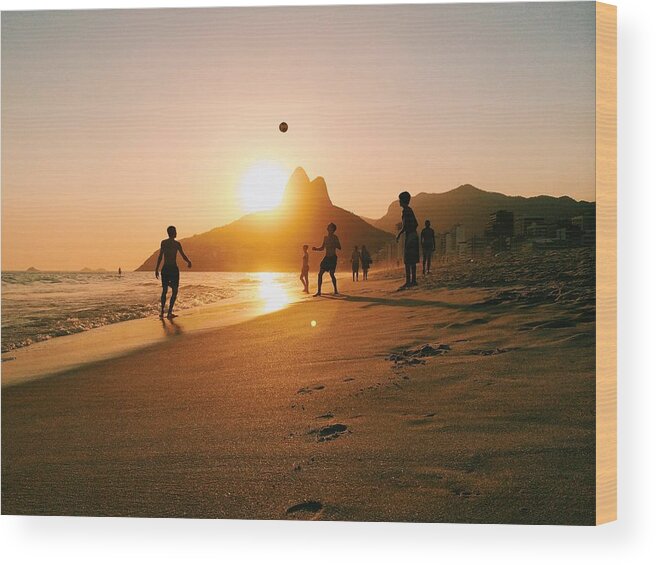 South America Wood Print featuring the photograph People playing football on Ipanema beach in Rio by Alexander Spatari
