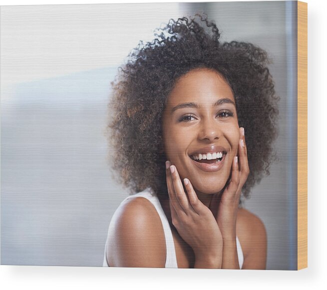 People Wood Print featuring the photograph Smooth skin puts a smile on her face by PeopleImages