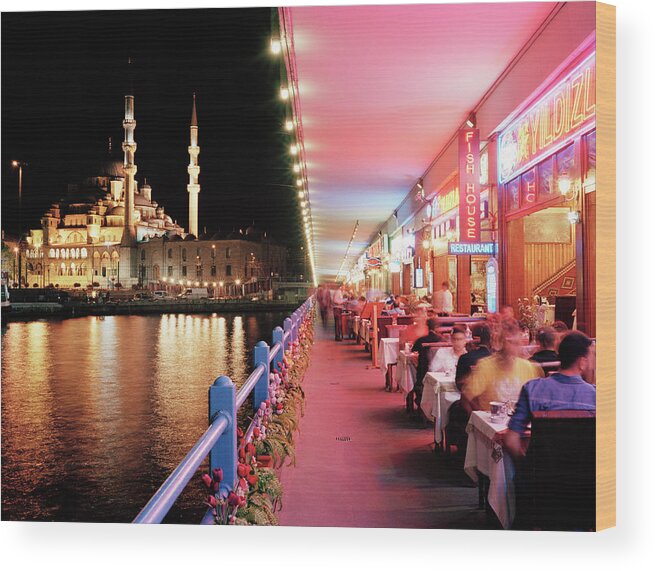 Istanbul Wood Print featuring the photograph Tourists Dining Along Galata Bridge At by Gary Yeowell