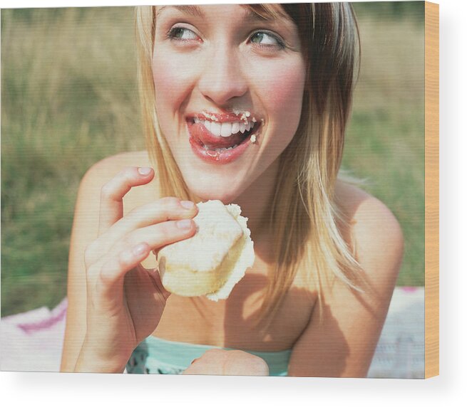 People Wood Print featuring the photograph Woman eating a cake by Image Source