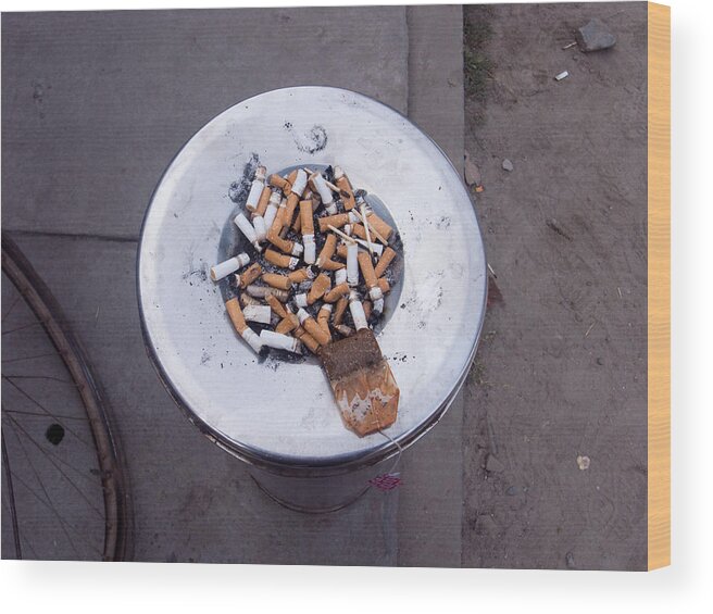 Stubs Wood Print featuring the photograph A lot of cigarettes stubbed out at a garbage bin by Ashish Agarwal