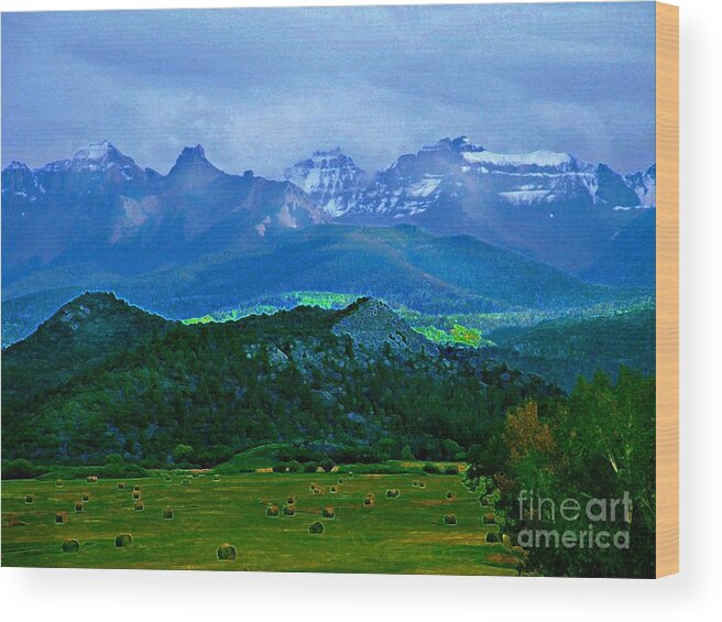 Blues And Greens Show Off This Mysterious And Peaceful Colorado Scene Of Hay Fields And Majestic Mountains. Wood Print featuring the digital art Fall before the San Juans by Annie Gibbons