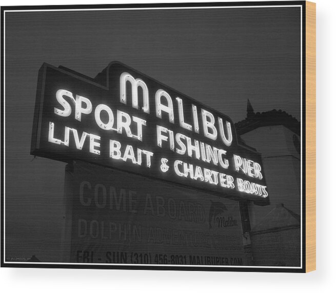 Iconic Wood Print featuring the photograph Malibu Pier Sign In BW by Glenn McCarthy Art and Photography
