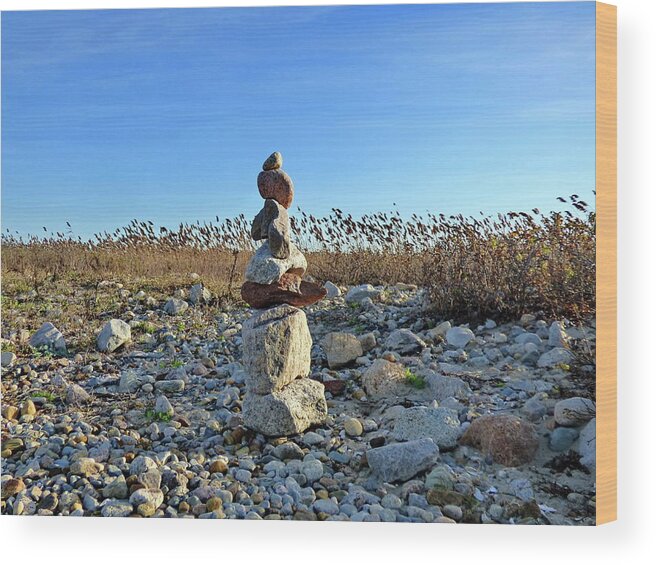 Inuksuk Wood Print featuring the photograph Sculpture on the Beach, Symbol of Hope and Friendship by Lyuba Filatova